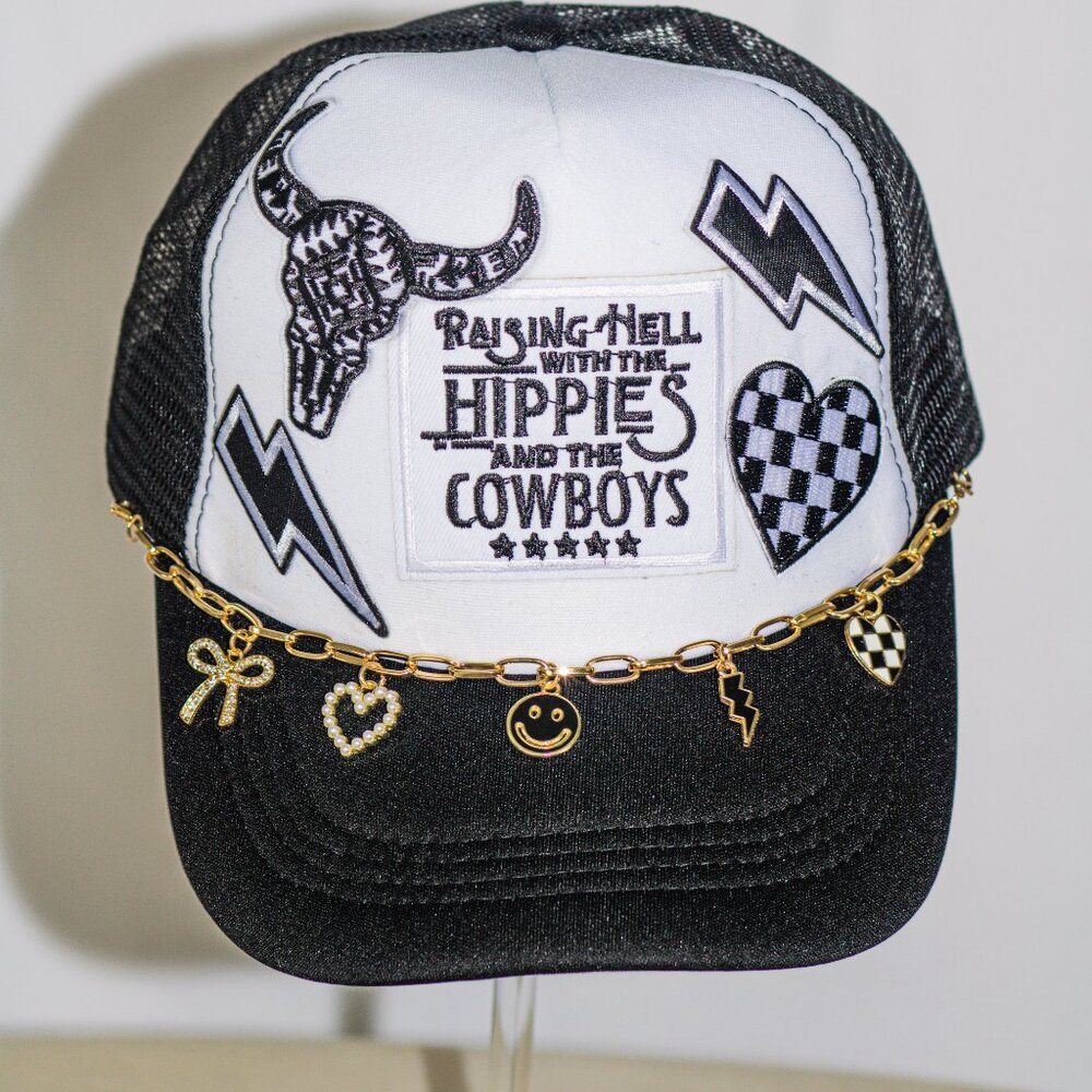 Black and white "Raisin hell" trucker hat with hat jewelry